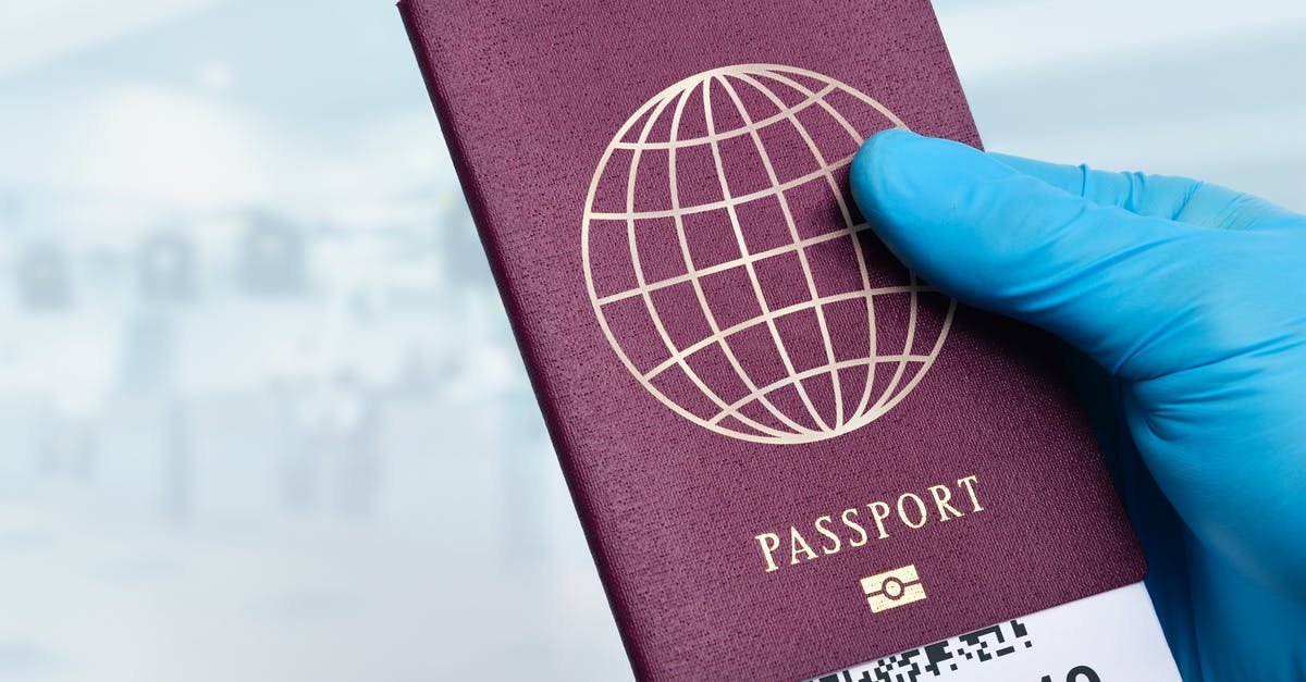 Spanish student travelling to Ypres holding only a Spanish ID Card and no passport [closed] - 
A Close-Up Shot of a Person Wearing a Latex Gloves Holding a Passport