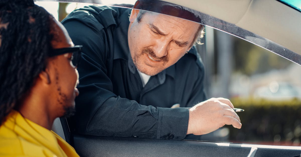 Speeding ticket in Germany [closed] - Man Talking to the Person Inside the Car 