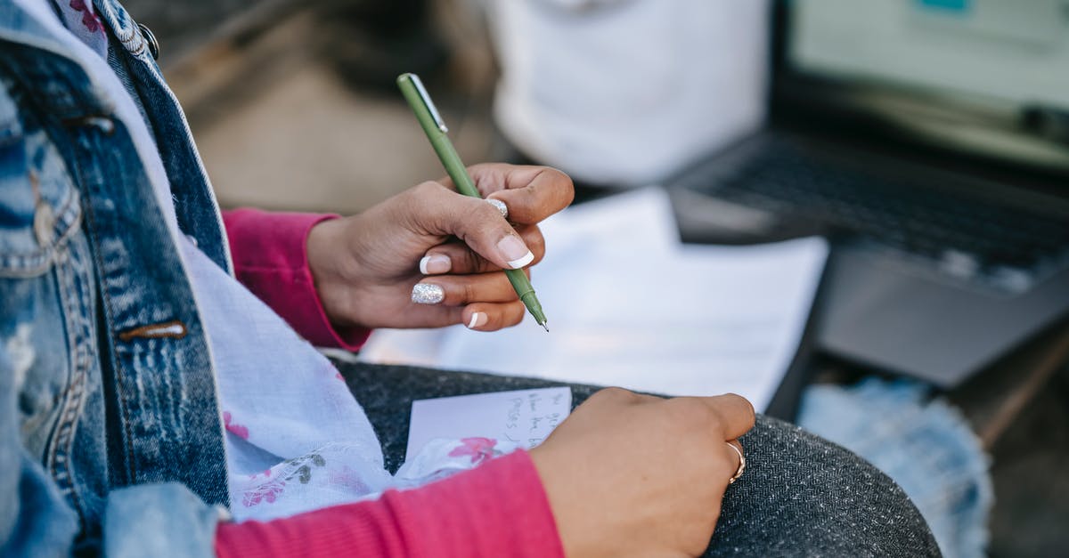 Sponsorship Letter for UK Student Visa [closed] - Crop anonymous female student writing notes on paper placed on knees while sitting on bench with laptop in city street