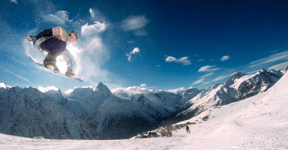 Springtime Ski Resorts near NYC - Man Snowboarding Springtime Ski Resorts near NYC - Man Snowboarding