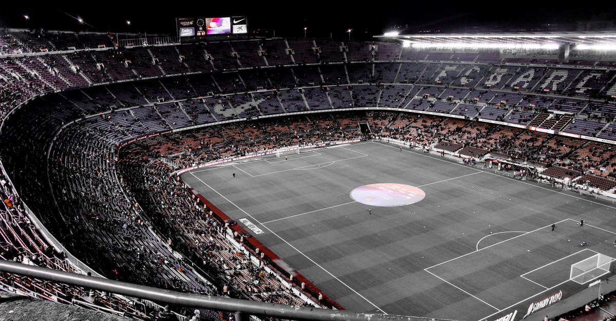 Standard Visitor Visa refusal grounds V 4.2 (e) (opacity) - Modern football stadium with spectators on tribunes