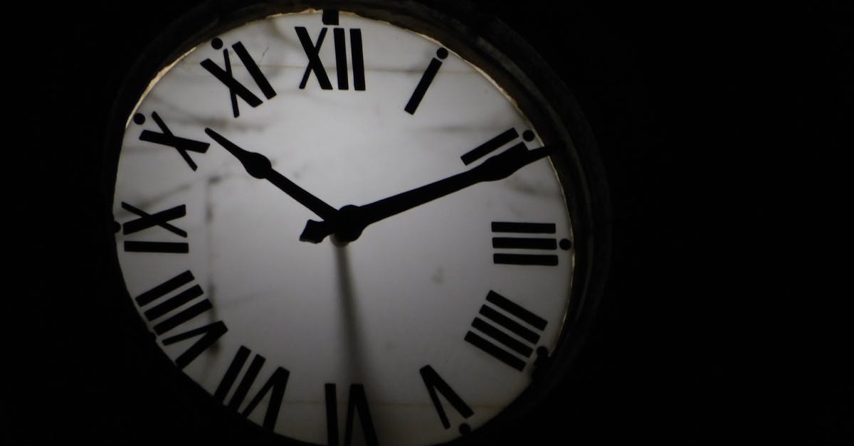Standard Visitor visa refused (V4.2) for the second time - Round mechanical clock with black arrows and numbers on white face ticking on black background in darkness
