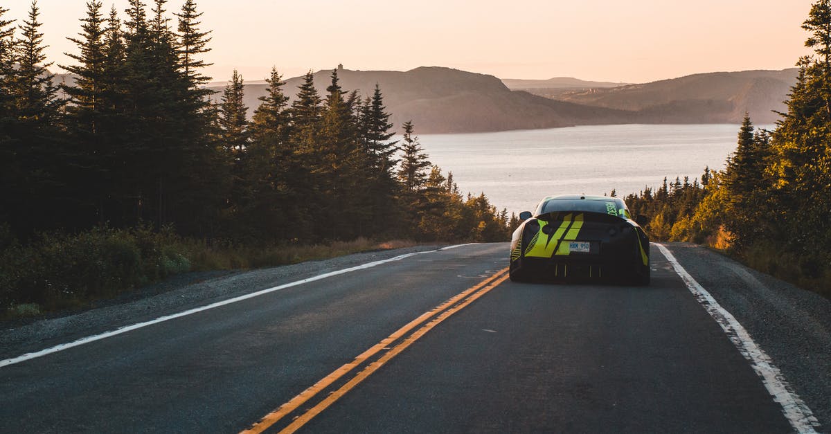 Star Alliance - direct routes - Fashionable sport car driving to sea in mountains Star Alliance - direct routes - Fashionable sport car driving to sea in mountains