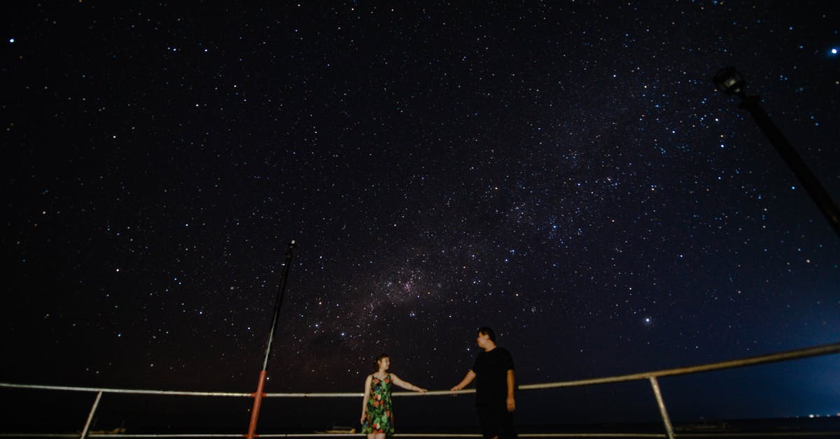 Star Alliance programme with free expiry date extension - Couple on viewpoint near railing under starry sky at night Star Alliance programme with free expiry date extension - Couple on viewpoint near railing under starry sky at night