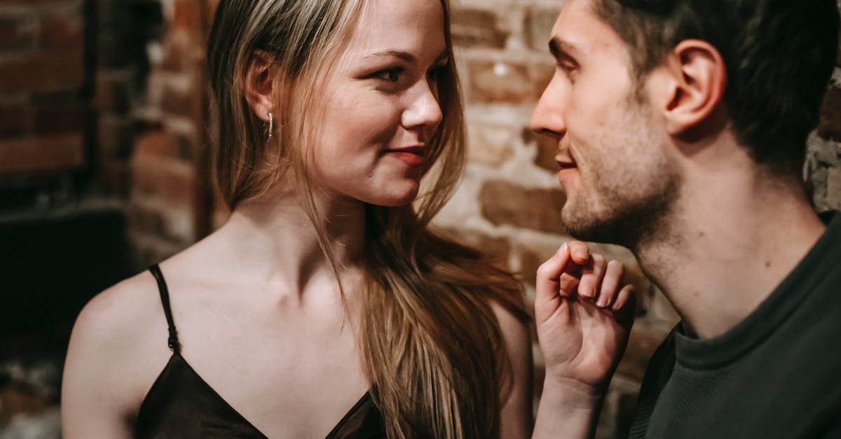 Star Alliance programme with free expiry date extension - Young man and woman looking at each other enjoying romantic date together in cafe Star Alliance programme with free expiry date extension - Young man and woman looking at each other enjoying romantic date together in cafe
