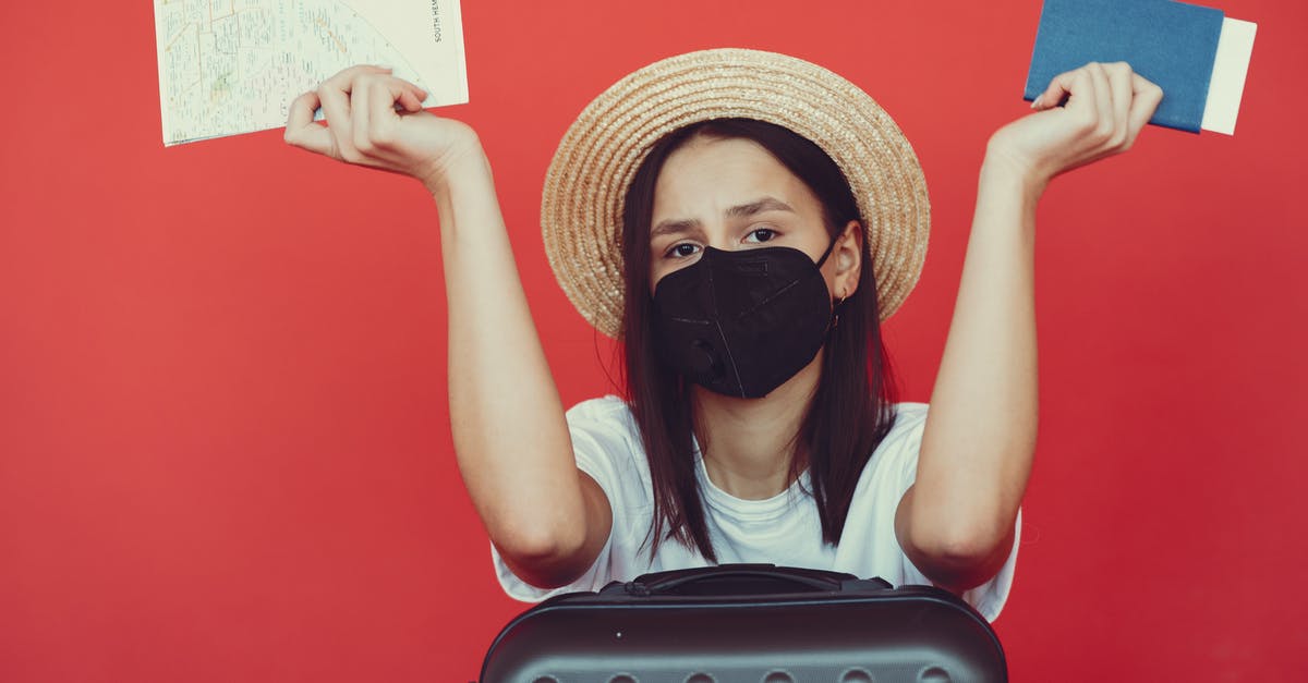 Staying in Canada beyond eTA and passport expiration [duplicate] - Sad woman in respiratory mask with suitcase and passport