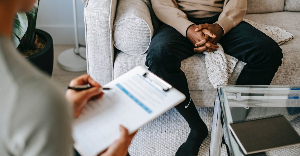 Still waiting for a decision on my visit visa application - Crop ethnic client discussing problems with anonymous psychologist Still waiting for a decision on my visit visa application - Crop ethnic client discussing problems with anonymous psychologist