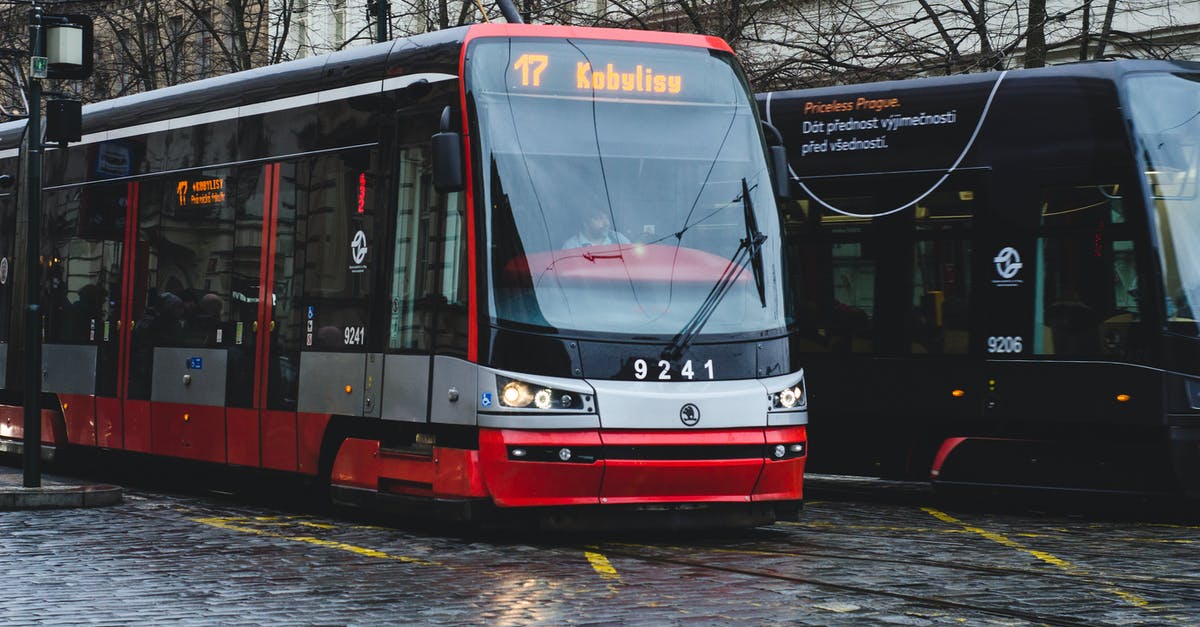 Stockholm public transport on 26th December - Red and White Tram on Road Stockholm public transport on 26th December - Red and White Tram on Road