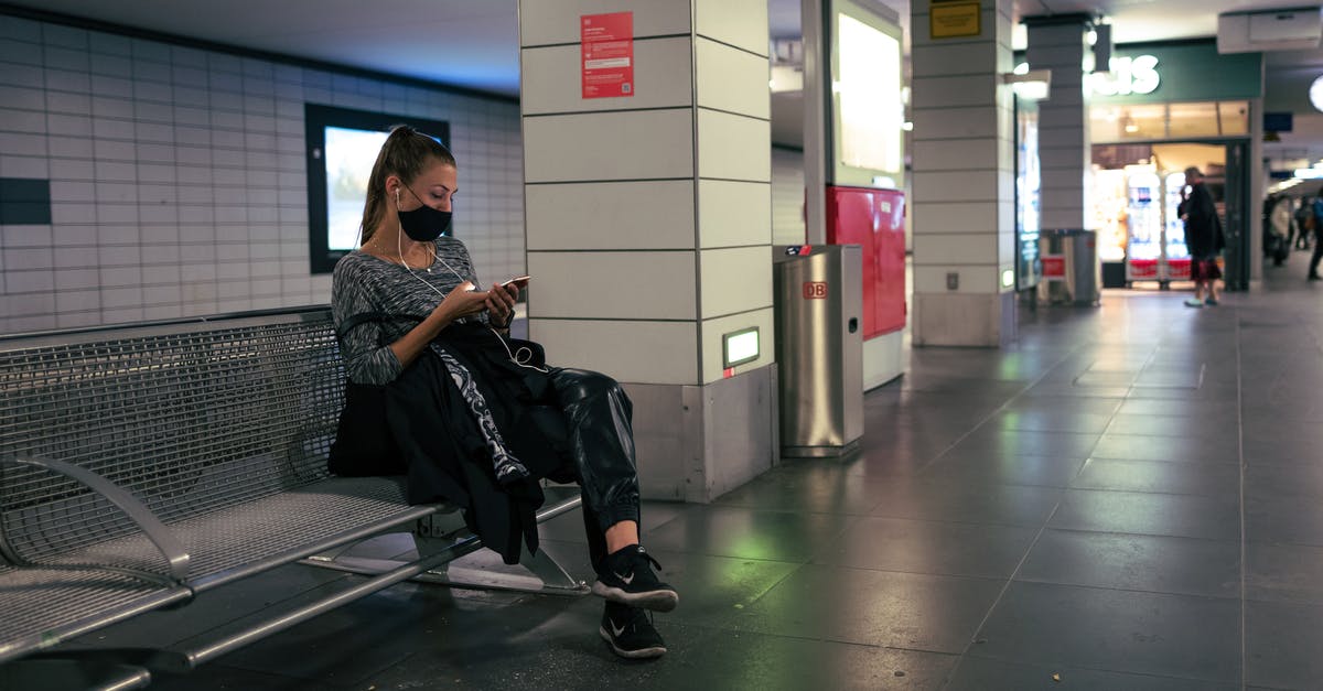 Stop in Hong Kong 3:30 hrs [duplicate] - Man in Black Jacket Sitting on Black Chair
