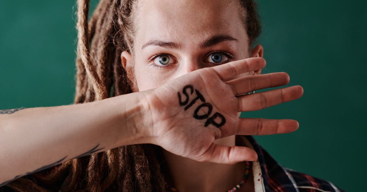 Stop over in London [closed] - Woman With Beaded Necklace Covering Her Mouth With Her Hand