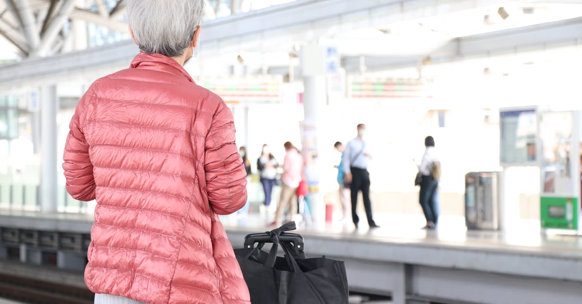 Storing luggage in Paris? - Woman Waiting on Train Station Storing luggage in Paris? - Woman Waiting on Train Station