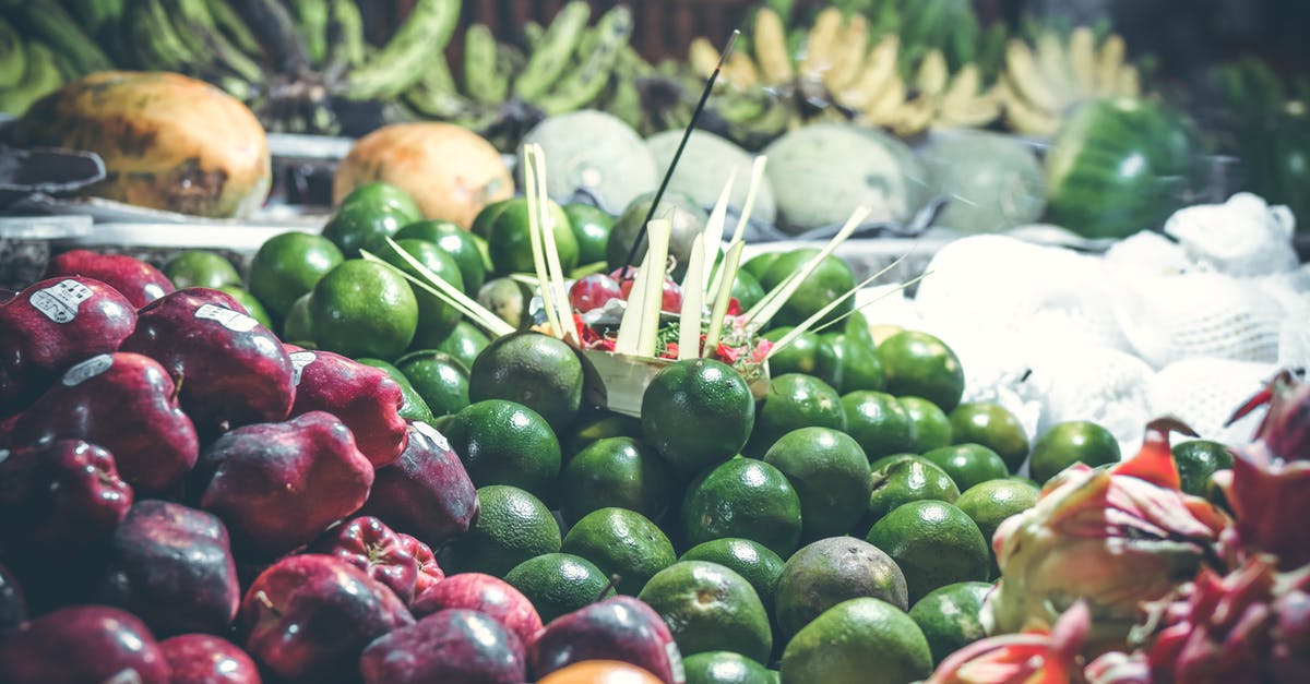 Street food spots in Hong Kong [closed] - Close-up Photography of Green and Red Fruit Lot