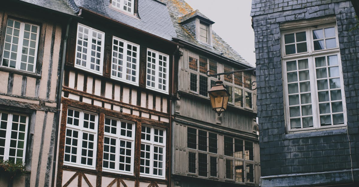 Sunbathing naked in public parks in Germany - Historic city street with typical houses in Bavarian style with decorative timber frames in daylight