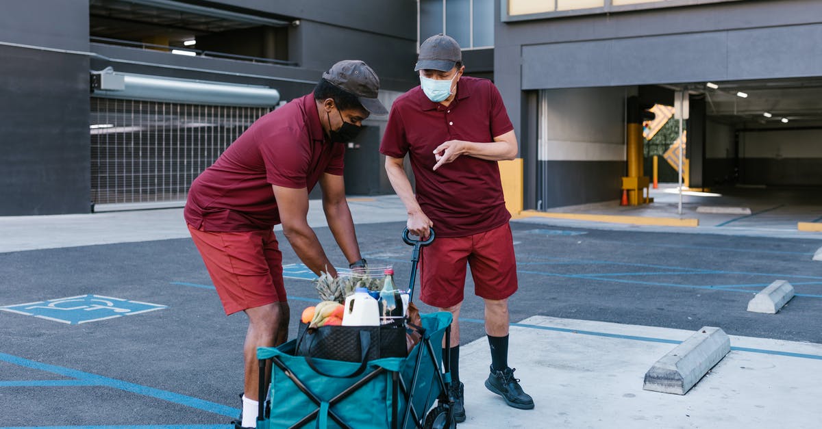 Surinam nationality and Carte Sejours validity - Man in Red T-shirt and Orange Pants With Blue and Black Bag on Black and Surinam nationality and Carte Sejours validity - Man in Red T-shirt and Orange Pants With Blue and Black Bag on Black and