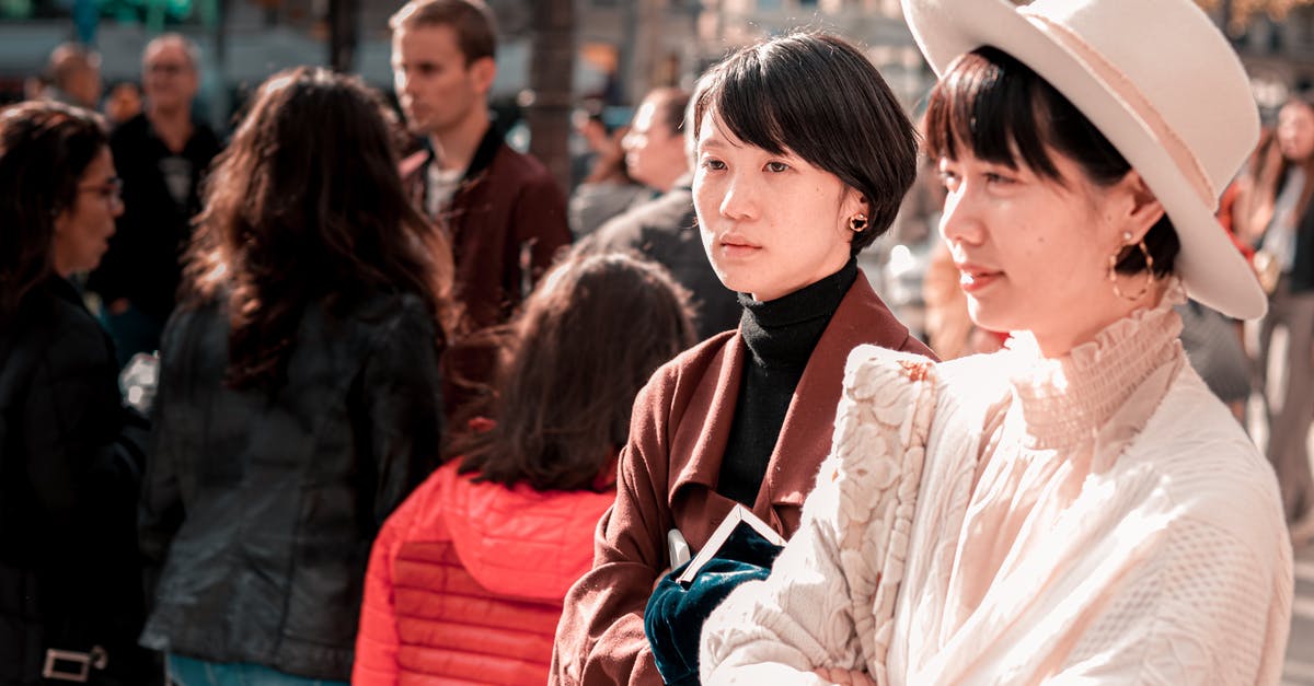 Sweden tourist or visiting a friend visa - Stylish ethnic women standing on street on sunny day Sweden tourist or visiting a friend visa - Stylish ethnic women standing on street on sunny day