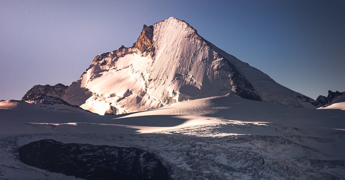 Swiss mountain peaks in February - suitable weather conditions? - Snow Covered Mountain Under Blue Sky Swiss mountain peaks in February - suitable weather conditions? - Snow Covered Mountain Under Blue Sky