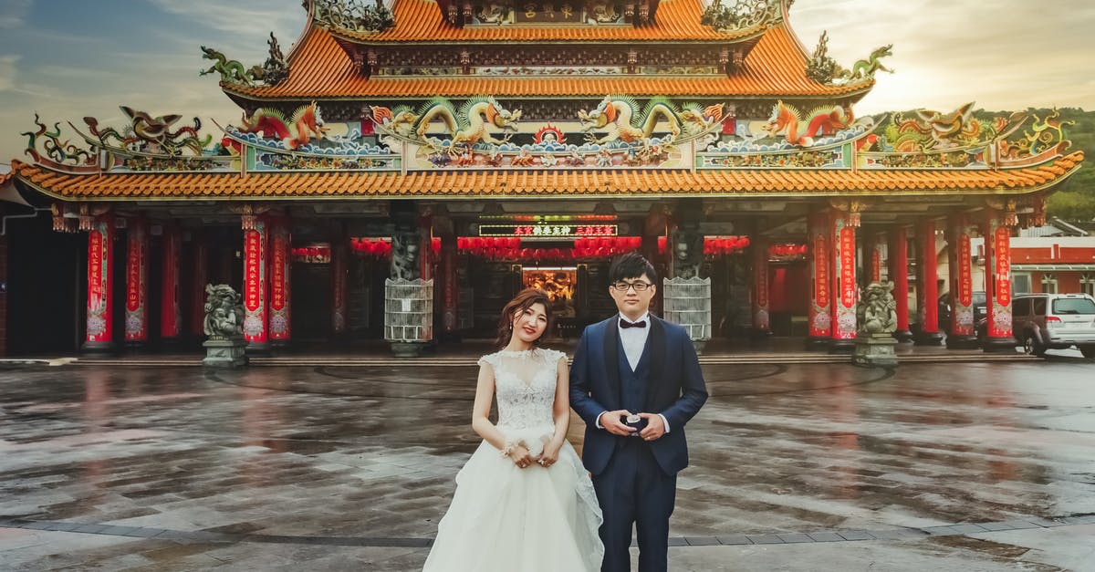 Taiwan maximum stay rules with reentry - Man and Woman in Wedding Dress Standing Near Red Temple Taiwan maximum stay rules with reentry - Man and Woman in Wedding Dress Standing Near Red Temple