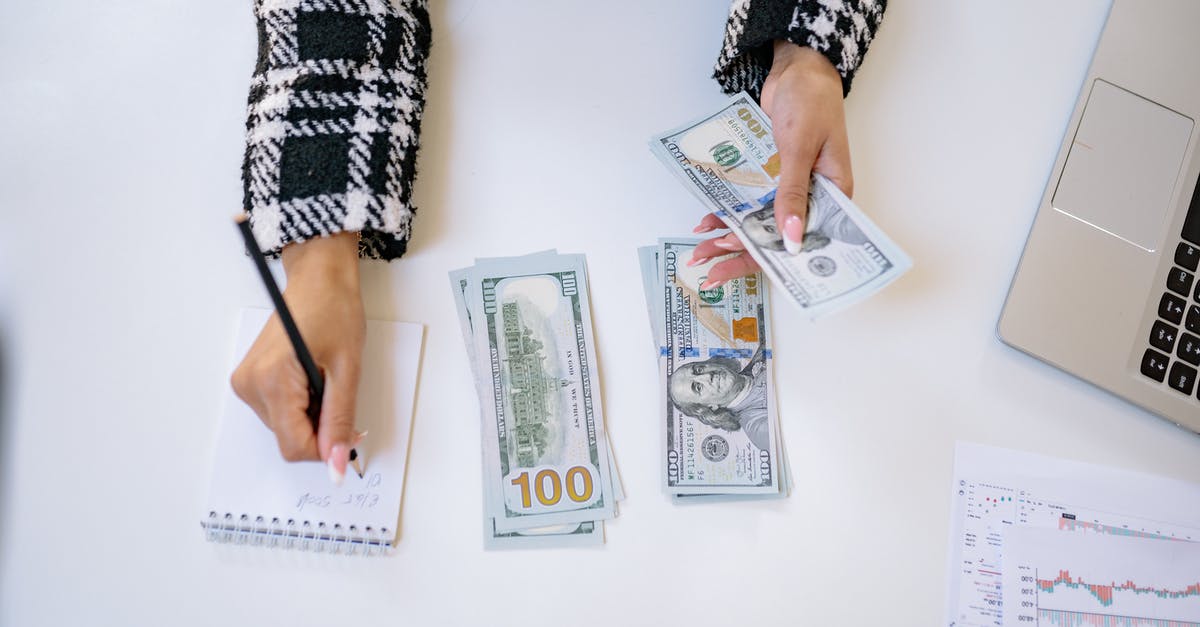 Taking cash to the UK and France - A Person Taking Notes while Counting Money Taking cash to the UK and France - A Person Taking Notes while Counting Money