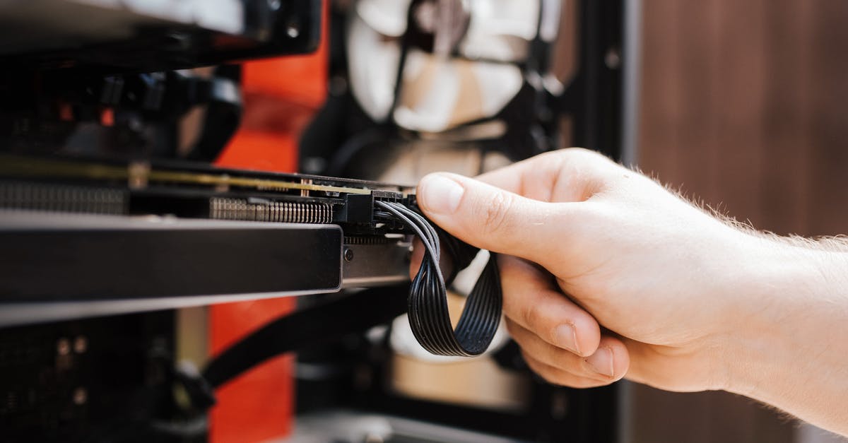 Taking electronic equipment to India from USA - Crop faceless man fixing cables in system unit Taking electronic equipment to India from USA - Crop faceless man fixing cables in system unit