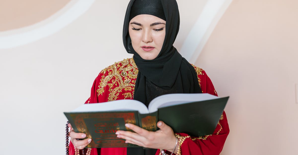 Taking prescribed amphetamines to Dubai or India - Woman in Black Hijab Holding Book Taking prescribed amphetamines to Dubai or India - Woman in Black Hijab Holding Book