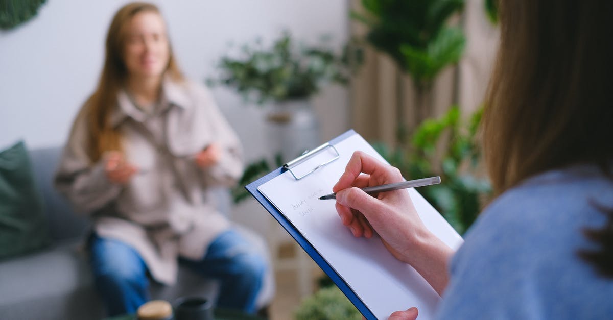 Taking someone else's cancelled German visa appointment slot - realistic? - Unrecognizable professional female psychologist writing on clipboard while sitting against client on blurred background during psychotherapy session in light office Taking someone else's cancelled German visa appointment slot - realistic? - Unrecognizable professional female psychologist writing on clipboard while sitting against client on blurred background during psychotherapy session in light office