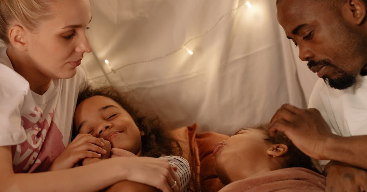 Taking woman and biological child out of China [closed] - A Couple Looking their Daughters while Sleeping