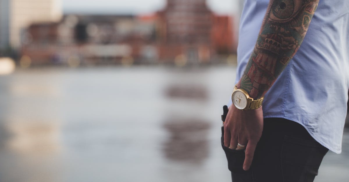 Tattoos while Traveling Overseas - Selective Focus Photography of Man Wearing Blue Shirt Tattoos while Traveling Overseas - Selective Focus Photography of Man Wearing Blue Shirt
