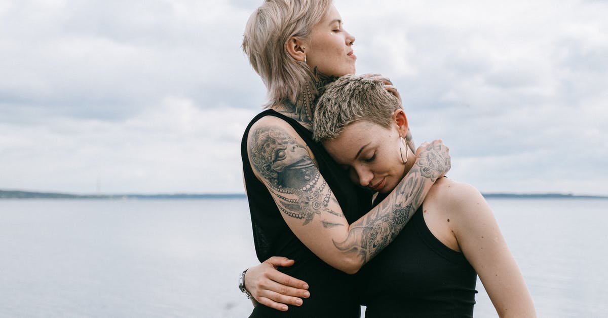 Tattoos while Traveling Overseas - Women Hugging on Beach Tattoos while Traveling Overseas - Women Hugging on Beach