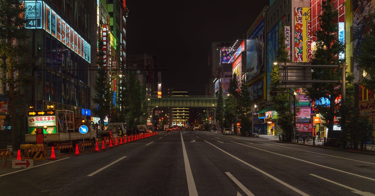 Tax exemption in Tokyo - Cars on Road in City during Night Time Tax exemption in Tokyo - Cars on Road in City during Night Time
