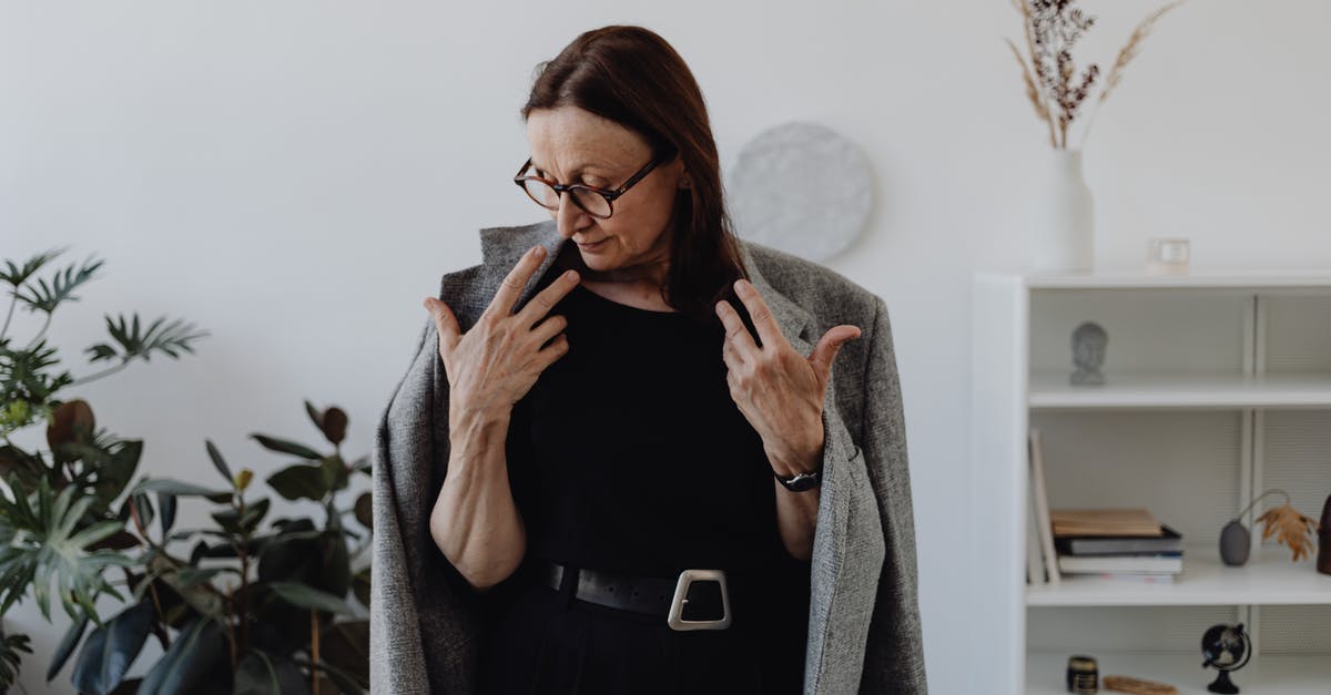 Temporary loss of passport (EU citizen in other EU country) - Mature Woman in Black Dress and Gray Coat