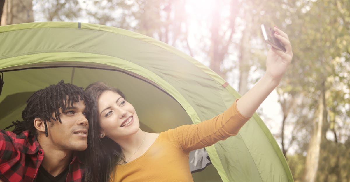 Tent in hand luggage? - Man and Woman Taking Selfie Using Smartphone Tent in hand luggage? - Man and Woman Taking Selfie Using Smartphone