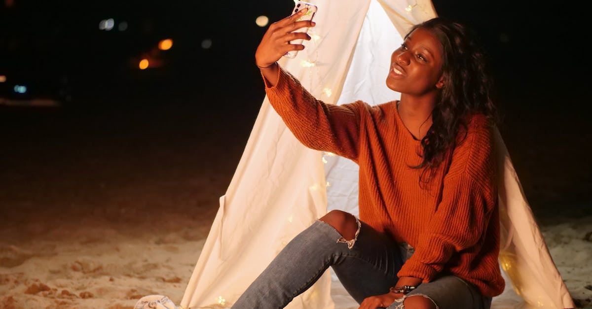 Tent in hand luggage? - Woman Leaning on a White Teepee Taking a Selfie Tent in hand luggage? - Woman Leaning on a White Teepee Taking a Selfie