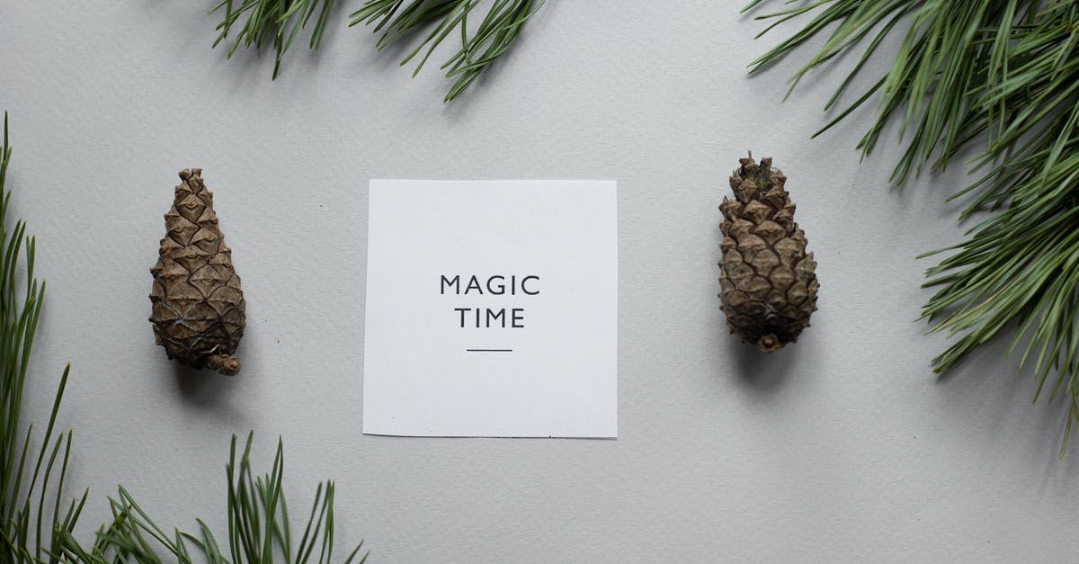 Text message delivery time from Europe to Asia - Composition of pine cones with greeting card Text message delivery time from Europe to Asia - Composition of pine cones with greeting card