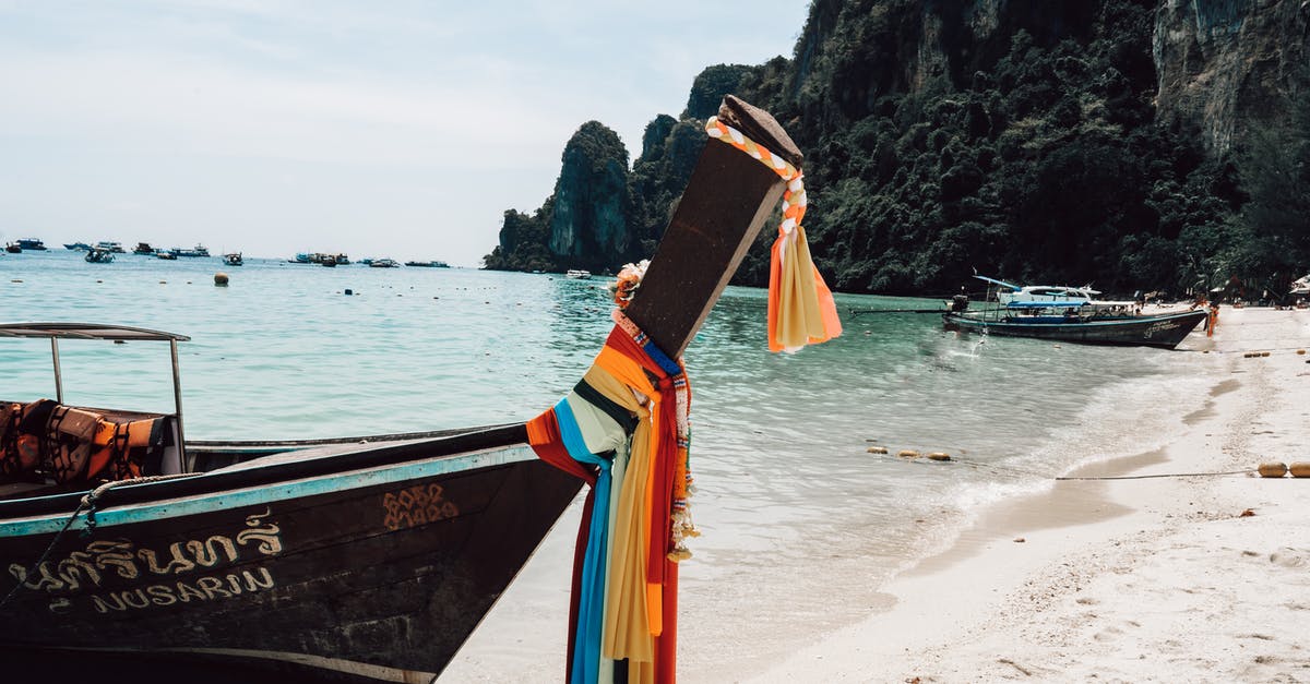 Thailand visa on arrival. How long does it take to get it? - Long tail boat on sandy seashore in tropical resort Thailand visa on arrival. How long does it take to get it? - Long tail boat on sandy seashore in tropical resort