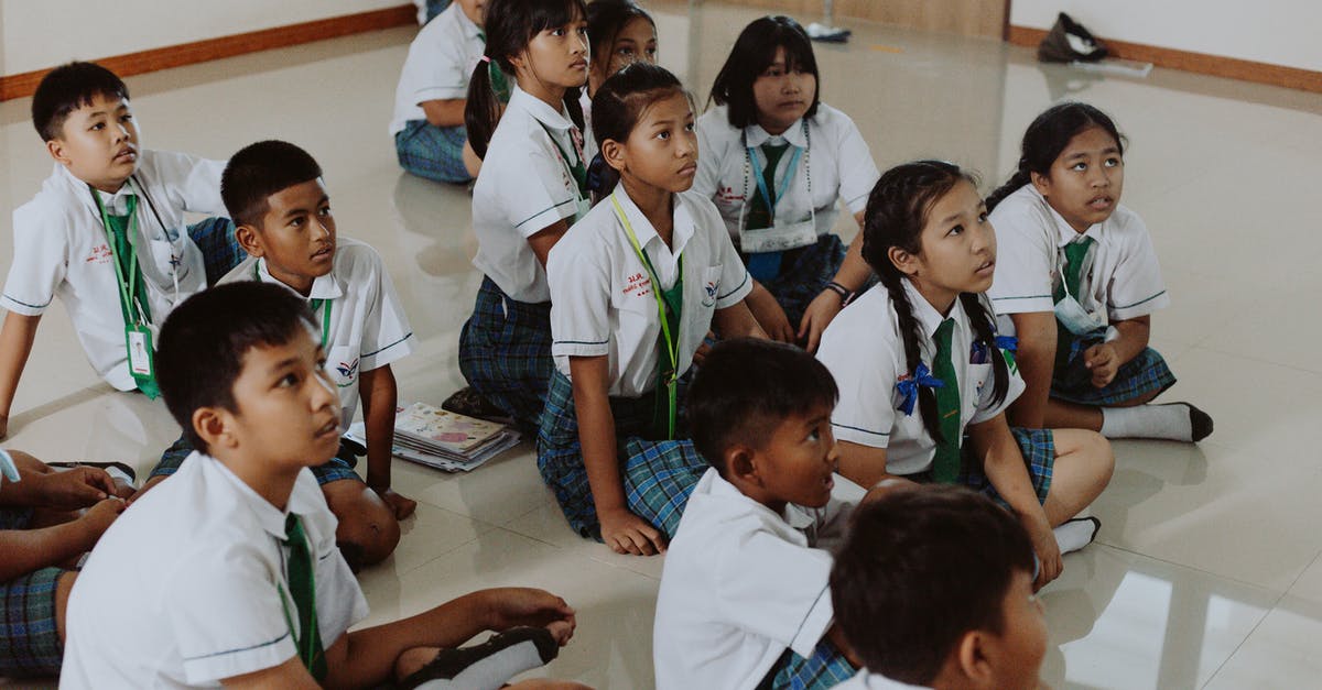 Thailand visa with a short visit to Cambodia - Children in School Uniforms Sitting on Floor in Classroom Thailand visa with a short visit to Cambodia - Children in School Uniforms Sitting on Floor in Classroom