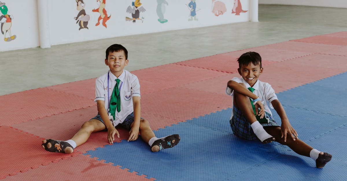 Thailand visa with a short visit to Cambodia - Portrait of Smiling Boys in School Uniforms Sitting in School Gymnasium Thailand visa with a short visit to Cambodia - Portrait of Smiling Boys in School Uniforms Sitting in School Gymnasium