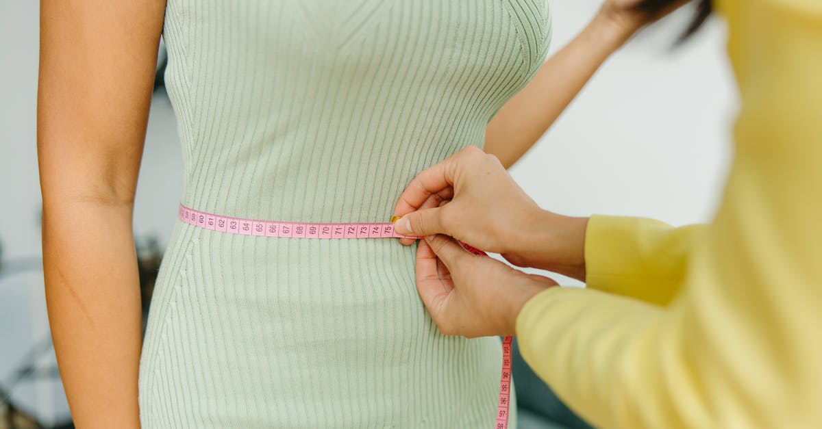 the $10,000 CAD limit is it by person or by family - Woman in White and Pink Stripe Dress Holding Pink Strap