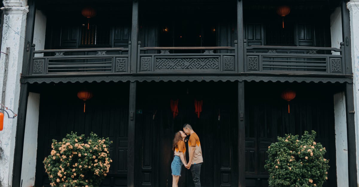 The date on my Schengen visa application doesn't match my ticket [closed] - Young happy Asian couple kissing near oriental building