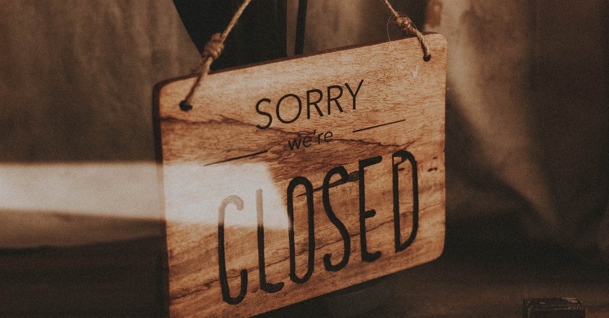The definition of 'refused entry at the border' [closed] - Through glass of wooden signboard with inscription Sorry We Are Closed hanging on doors of shop