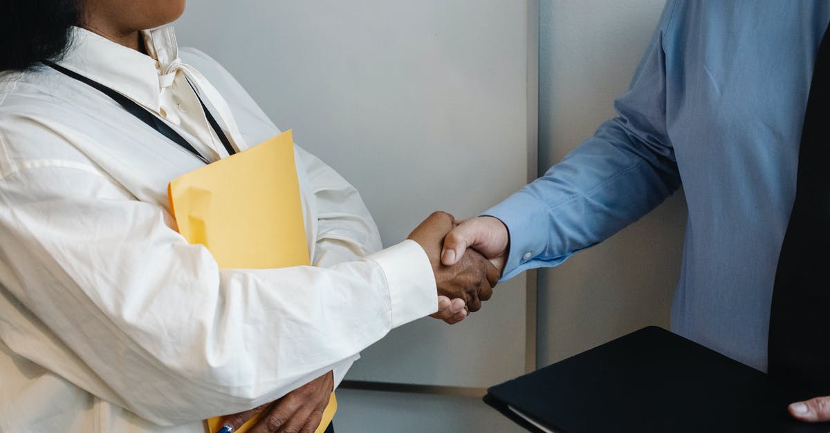 The fastest connection between Gatwick & Heathrow? - Diverse coworkers shaking hands after meeting The fastest connection between Gatwick & Heathrow? - Diverse coworkers shaking hands after meeting