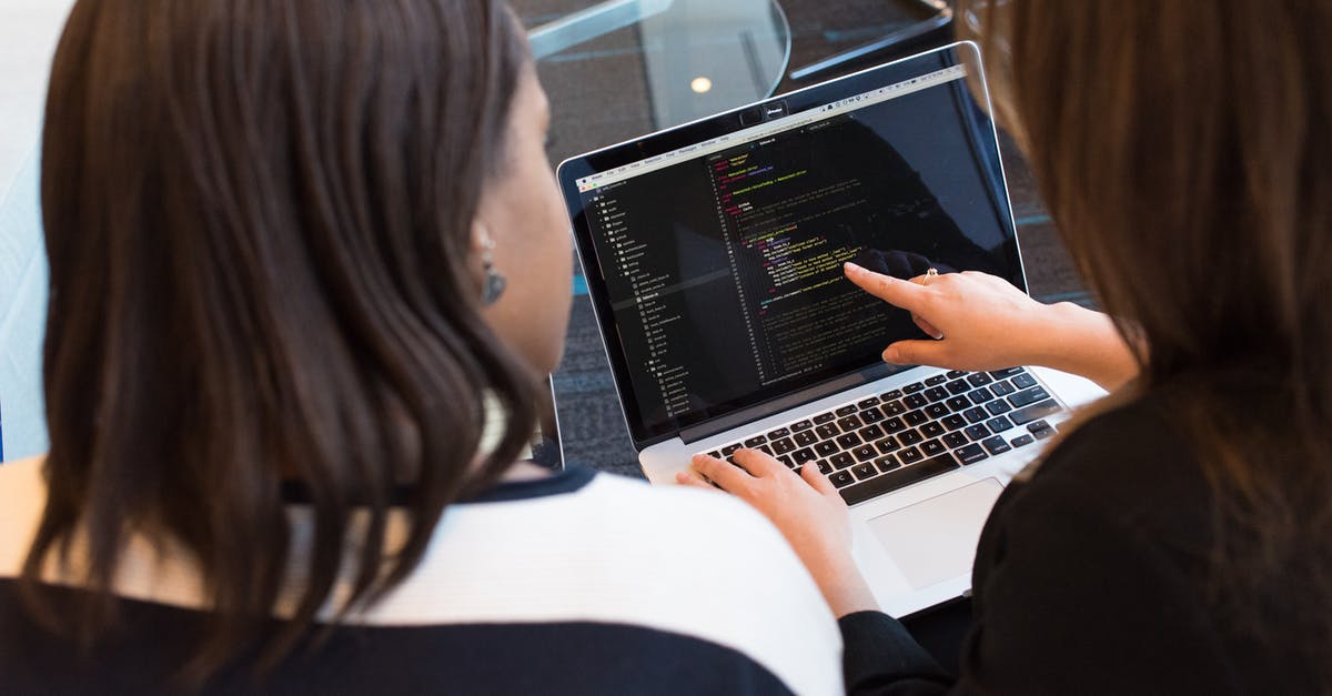 The screen on my laptop I checked in has stopped working. Could I claim something? [closed] - Two Women Looking at the Code at Laptop
