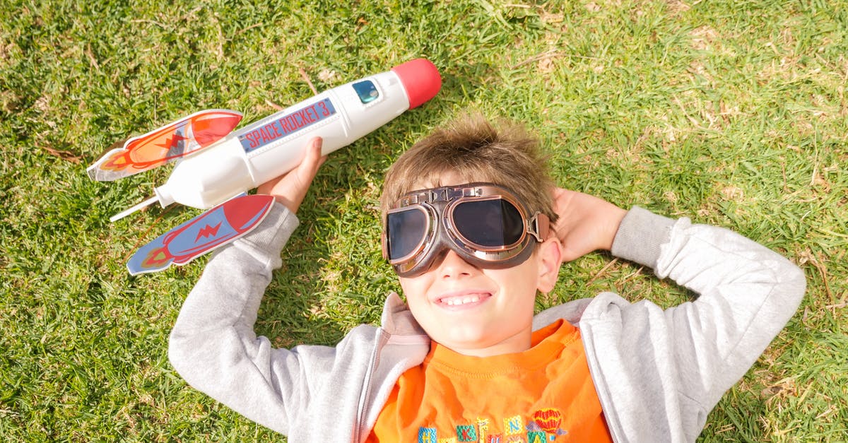 Things to do with young children in Paris in August - Boy in Gray and Orange Hoodie Wearing Black Sunglasses Things to do with young children in Paris in August - Boy in Gray and Orange Hoodie Wearing Black Sunglasses