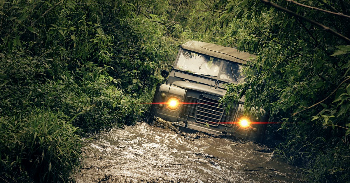 Things to keep in mind when going to the Amazon rain forest - Green Car Running of Flooded Road Things to keep in mind when going to the Amazon rain forest - Green Car Running of Flooded Road
