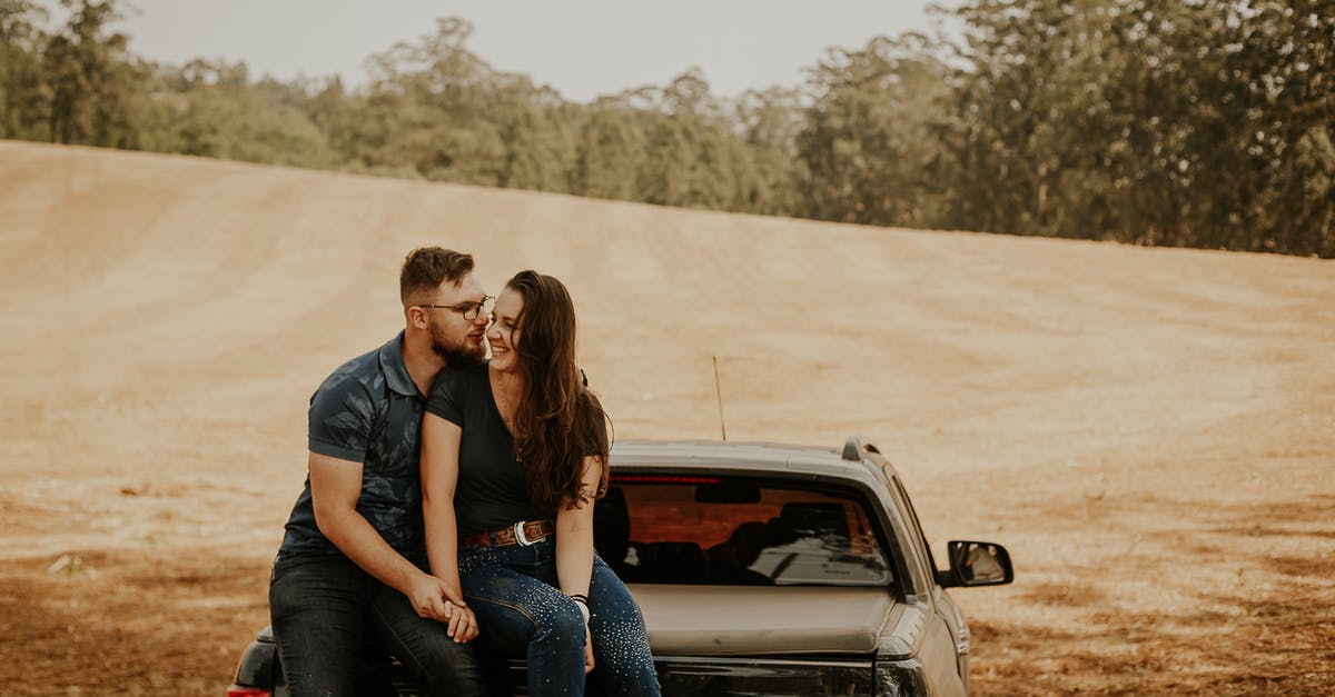 Throwaway ticketing: picking optimal return date - A Couple Sitting at The Back of a Pick Up Truck Throwaway ticketing: picking optimal return date - A Couple Sitting at The Back of a Pick Up Truck