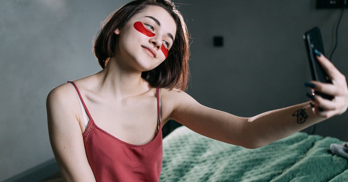 Tier 5 (Youth Mobility Visa) - Age [closed] - A Woman with an Under Eye Patches Taking a Selfie