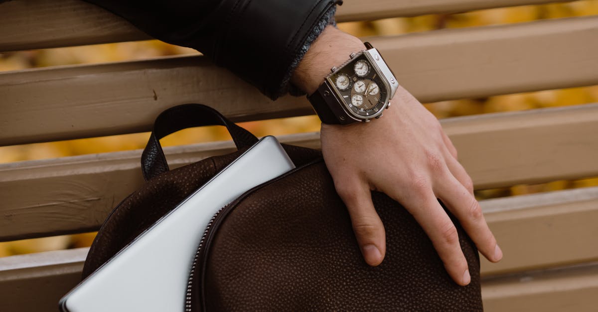Time to Recheck Bag? - Person Wearing a Wristwatch Time to Recheck Bag? - Person Wearing a Wristwatch