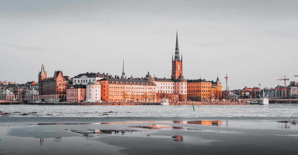 Time zones and capital cities - Brown and White Concrete Building Under Gray Sky Time zones and capital cities - Brown and White Concrete Building Under Gray Sky