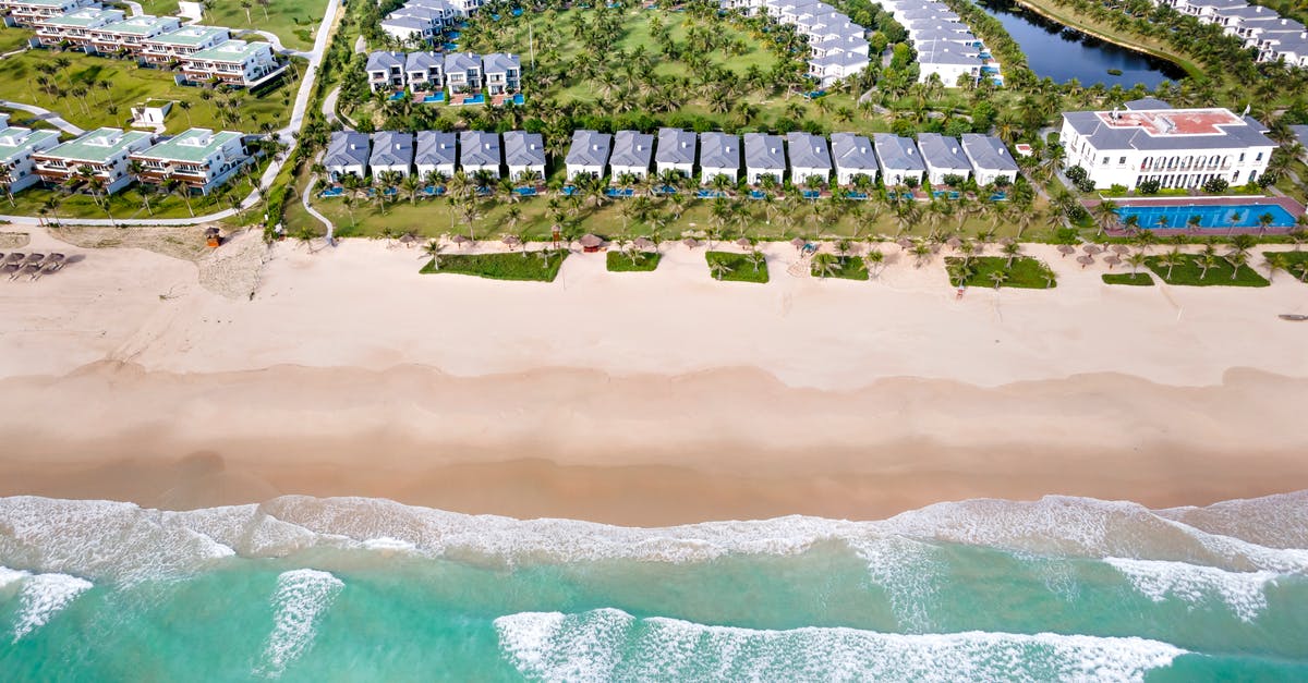 Tipping at all inclusive resort - Aerial View of Buildings Near the Shore Tipping at all inclusive resort - Aerial View of Buildings Near the Shore