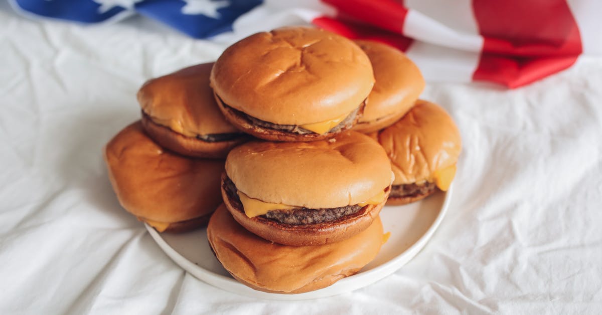 Tipping for curbside takeout food in the USA - Hamburgers on a White Plate Tipping for curbside takeout food in the USA - Hamburgers on a White Plate