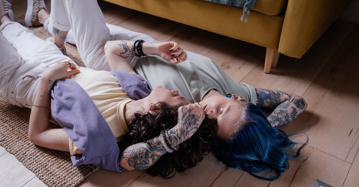 Tips for sleeping in a Couchette sleeping carriage? - Woman in White Long Sleeve Shirt Lying on Brown Wooden Floor Tips for sleeping in a Couchette sleeping carriage? - Woman in White Long Sleeve Shirt Lying on Brown Wooden Floor